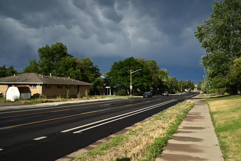 Storm clouds building over a suburban street